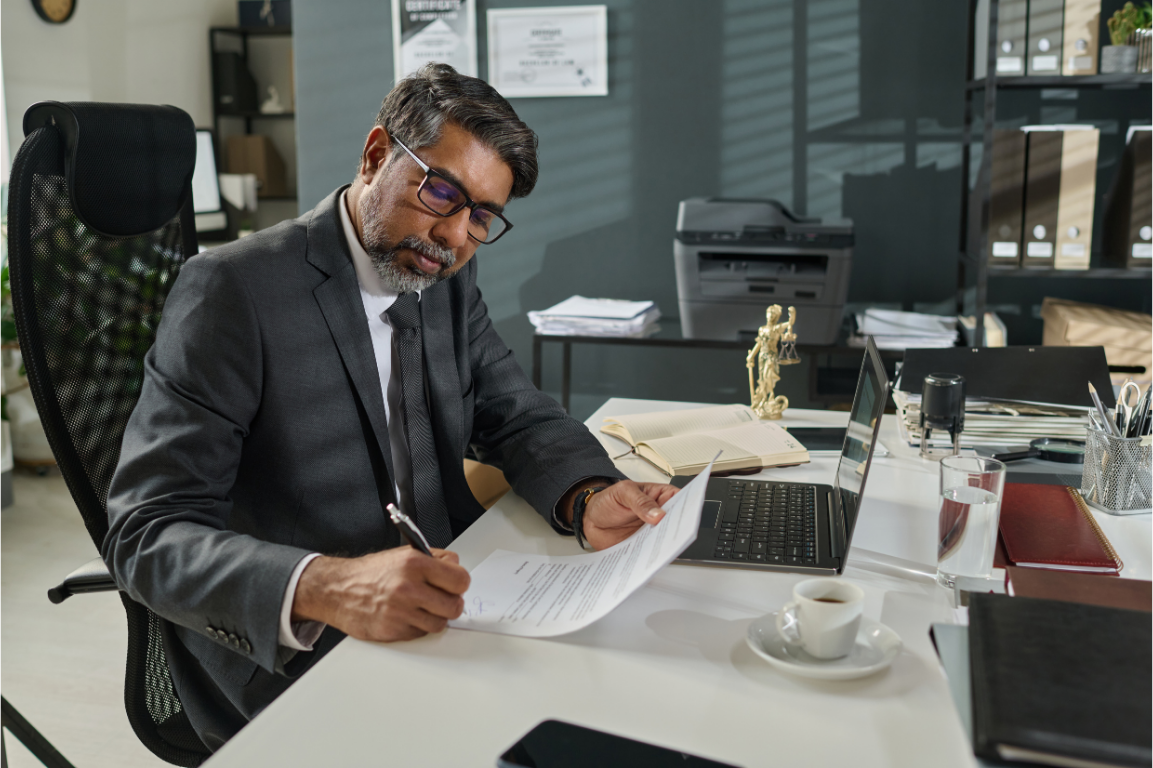 Solicitor reviewing paperwork in an office